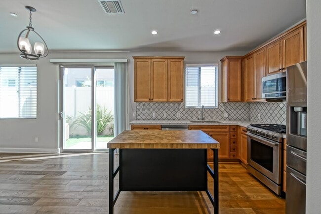 Building Photo - BUILT IN 2019: SPACIOUS & BRIGHT, DETACHED TOWNHOUSE W/ 2-CAR GARAGE & FENCED YARD IN GREAT RESID...