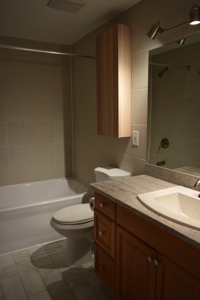 Building Photo - Updated 2-Bedroom Condo with Finished Basement, Garage, Pool, Tennis, Clubhouse