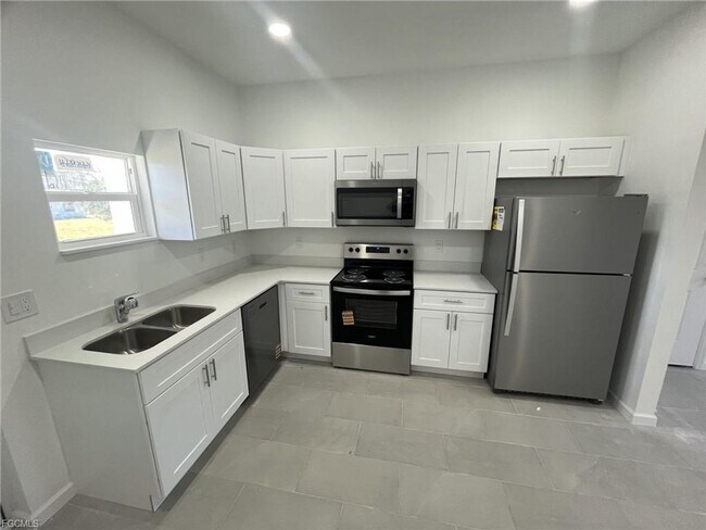 Building Photo - Brand new 2/1 -LARGE BACK YARD- LEHIGH ACRES