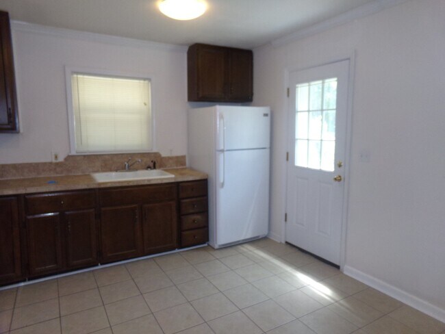Building Photo - 2BR/1BA Milton Duplex with Huge Fenced Backyard, Tile Flooring Throughout & Convenient Access to ...