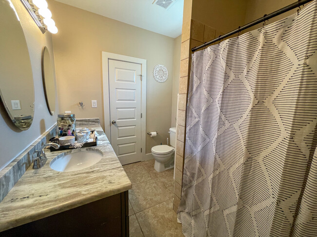 Double vanity master bathroom, with a walk-in closet. - 422 S Olive St