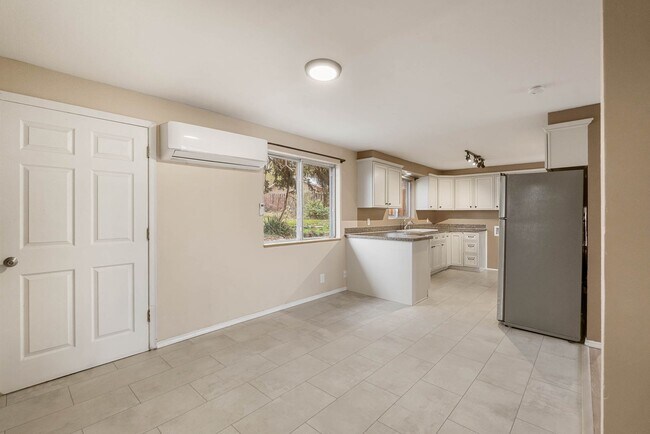 Building Photo - 4 Bedroom Home with Covered Parking & Fenced Backyard