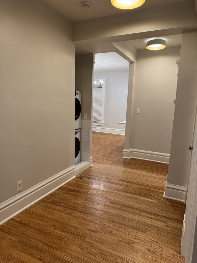 Stackable washer / dryer in hallway - 1049 Franklin Ave