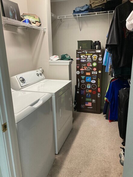 Walking in primary closet with W/D - 116 Amity Ln