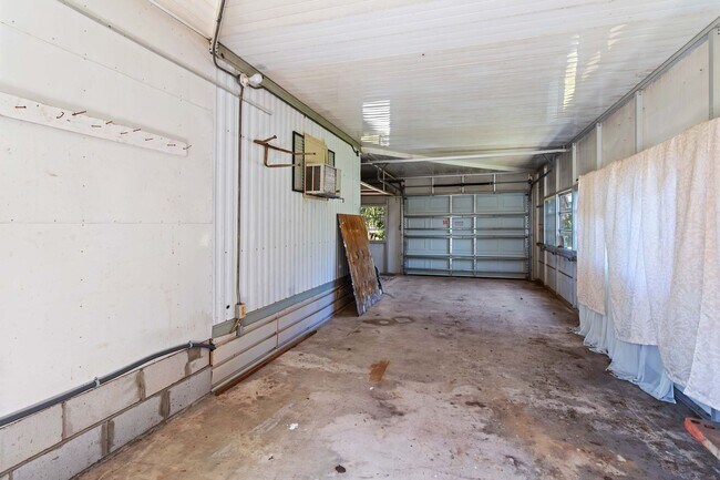 Building Photo - Charming 2BR/2BA Waterfront Home for Rent with Canal Access & Two Garages