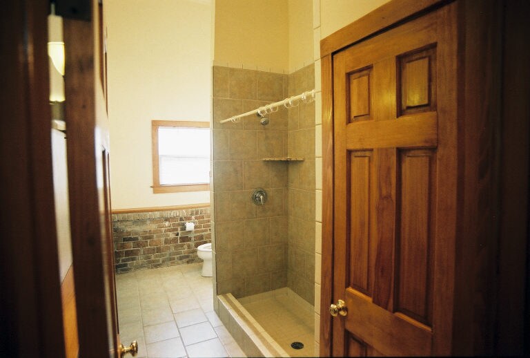 Large bathroom with tile shower and linen closet - 2039 Valence St