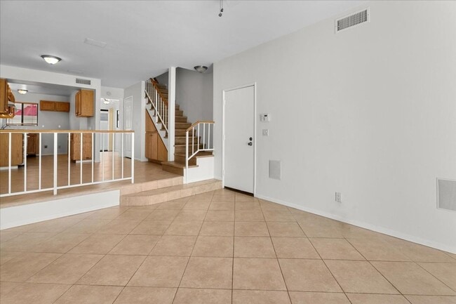 Building Photo - Light Filled Townhome Style Condo with Private Patios and Direct Access