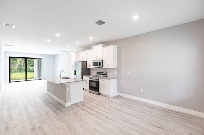 Building Photo - Brand New 4-Bedroom Gem with 2 Full Baths on Large Lot in Lehigh Acres – A Perfect Family Haven!