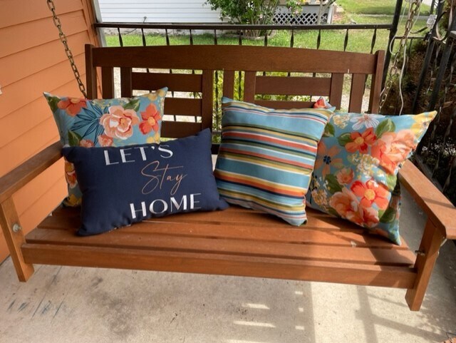 covered front porch with swing - 207 E Vermilya Ave