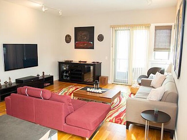 View of family/dining room along with door to access 2nd floor balcony. - 300 Van Buren St