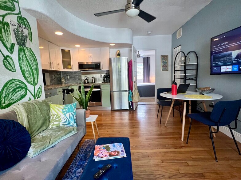 Living room with sofa sleeper and view of kitchen and dining table - 901 Euclid Ave