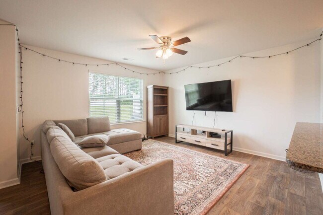 Building Photo - Partially furnished and now available!