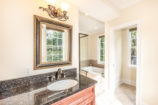 Ensuite master bathroom with glass-enclosed shower and garden tub - 175 Wentworth St