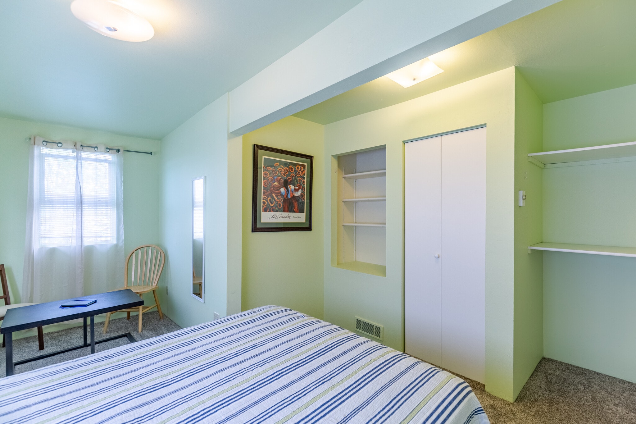 Iron and ironing board in the medium size closet. - 703 Q Ave Apt 4
