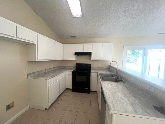 Building Photo - Freshley Painted! Updated Flooring! Pets o...