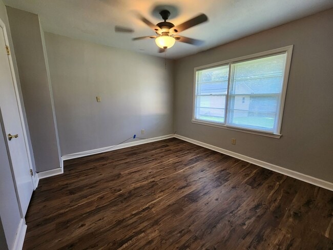 Building Photo - Spacious 4BR/2BA Brick Home with Fireplace, Large Island! NEW LVP Floors throughout!