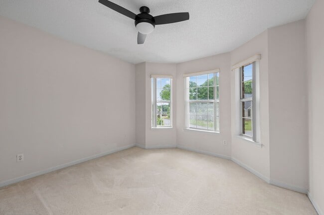 Building Photo - Spacious 3BR Retreat with Soaring Ceilings & Screened Porch