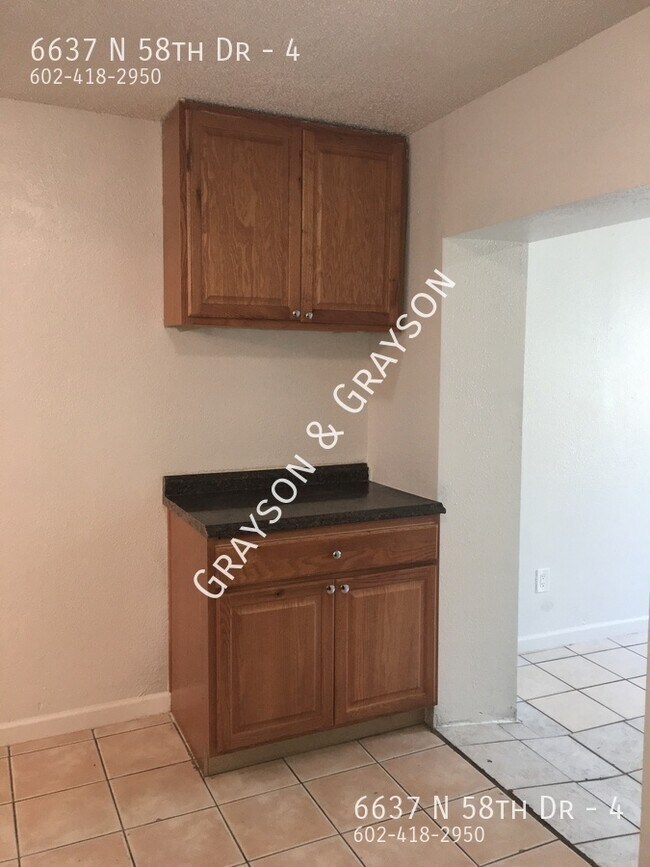 Building Photo - 6637 N 58th Dr