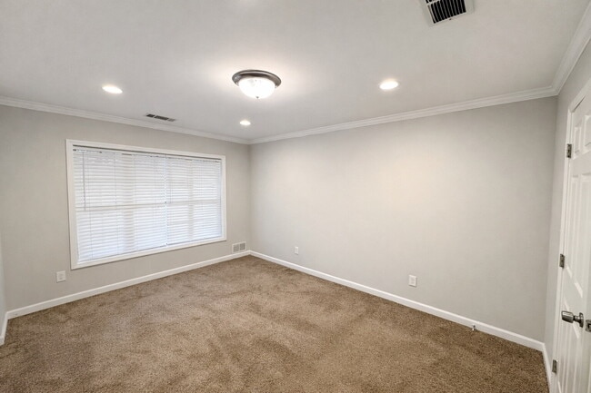 Building Photo - Gated Johns Creek Townhome Offering Space, Privacy, and Everyday Convenience