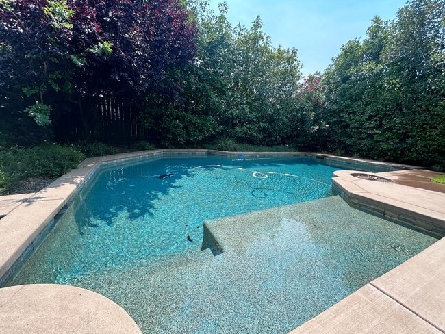 Building Photo - Four Bedroom Three Bathroom Home with a POOL