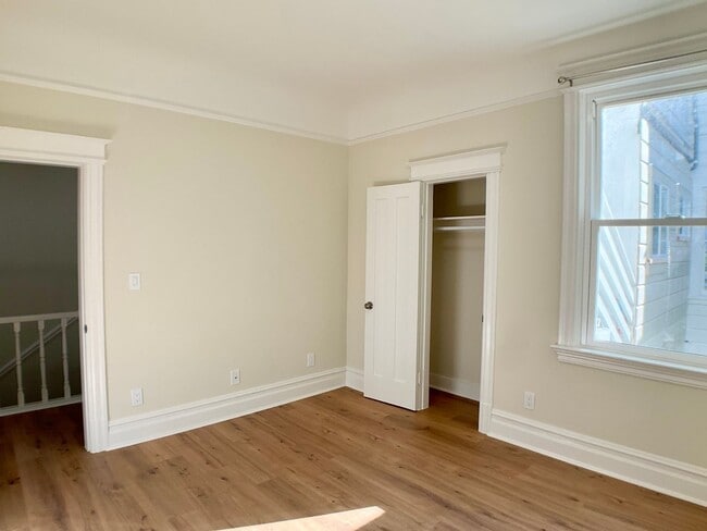 Building Photo - REMODELED 4BR/3BA. In Unit Laundry! Dishwasher! Bay Windows!