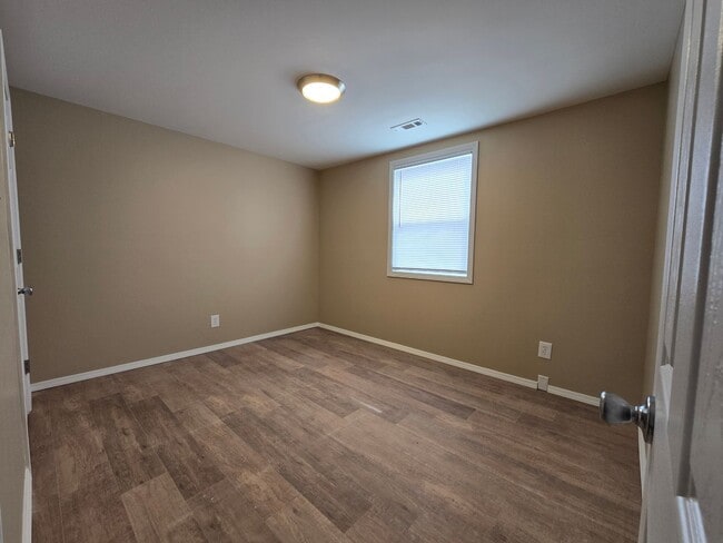 Building Photo - Corner Lot. Fenced Yard. Smells Like Fresh Paint & Good Decisions