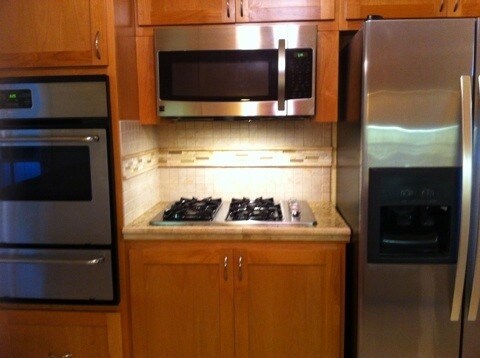 Kitchen with stainless steel appliances - 7823 Midfield Ave