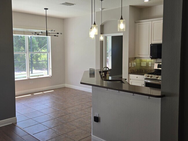 Building Photo - Freshly Painted 4BR/2BA Pool Home with Screened Pool & Spa – Move-In Ready!