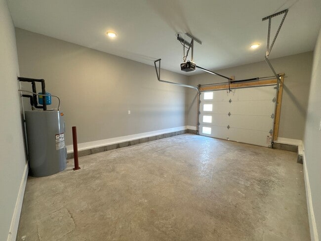 Building Photo - “Stylish 3BR End-Unit | Open Concept | Quartz Kitchen | Garage + Deck