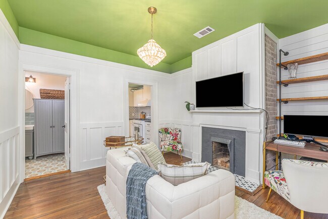 Decorative fireplace in living area - 108 W Henry St