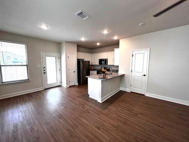 Building Photo - Move Fast! Gated Townhome Near Lackland AFB with Private Yard & EV-Ready Garage