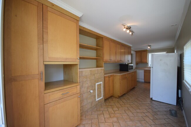 Custom built cabinetry with a built in laundry shoot - 1911 W 2nd St