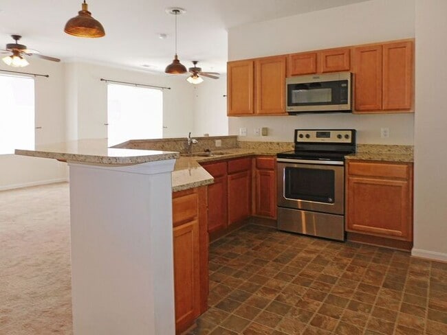 Building Photo - Pet Friendly Condo with Private Balcony and 1 Car Garage