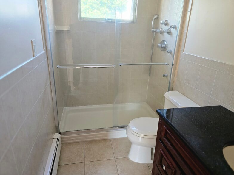 27 - Master Bedroom with attached Bathroom - 100 5th Ave