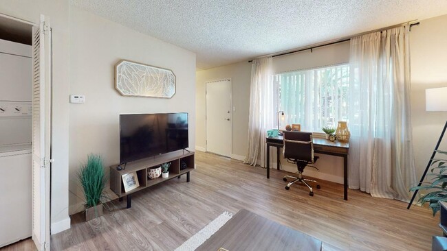 Living Area/Laundry - Cambridge House Apartments