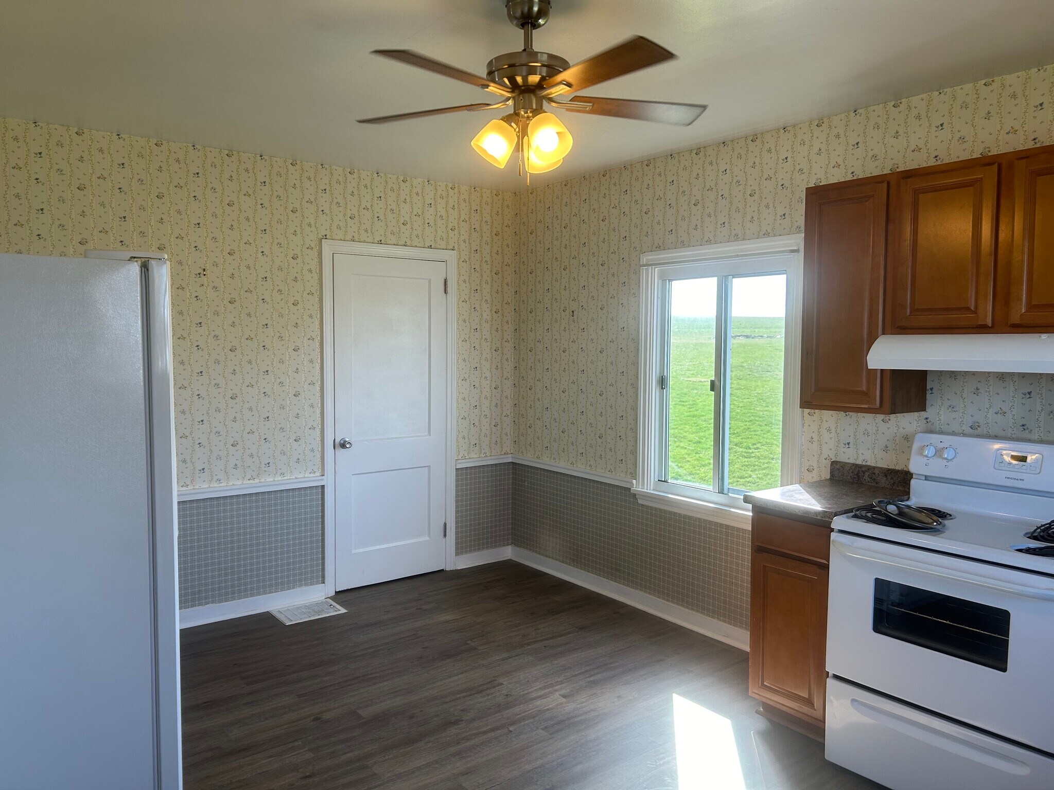 Kitchen includes charming wallpaper and a full pantry. - 203 Reibold Rd