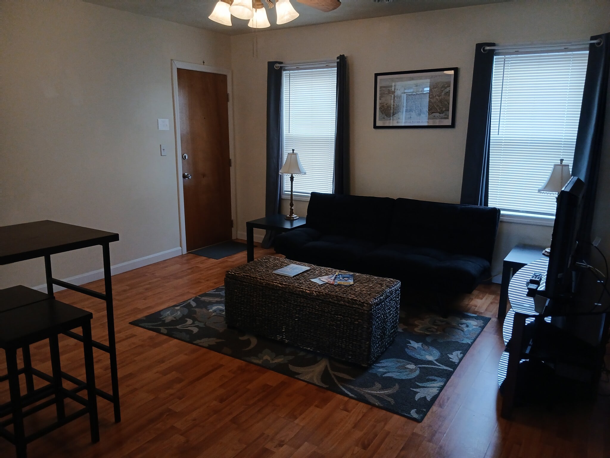 Living room with futon. - 56 Fulton St