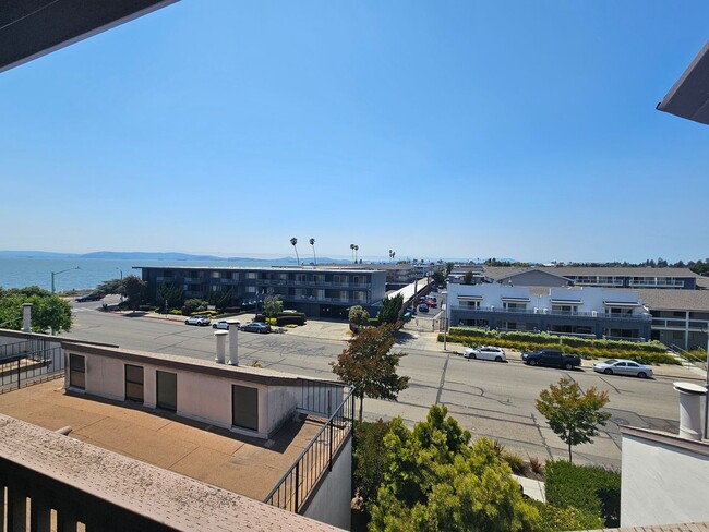 Building Photo - Shoreline Serenity: Modern Condo Steps fro...
