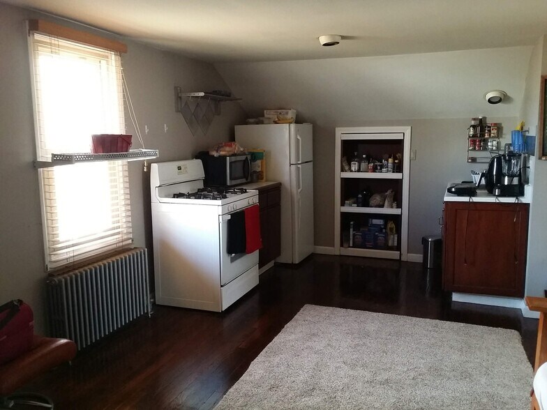 Small kitchen with pantry not shown, microwave, stove, fridge - 126 Clover Hill St