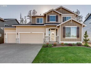Building Photo - 129 NE 58th Ave