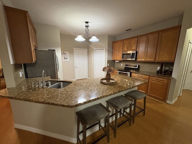 Building Photo - Florida Living Starts Here — Gated, Single-Story, Move-In Ready May 1!