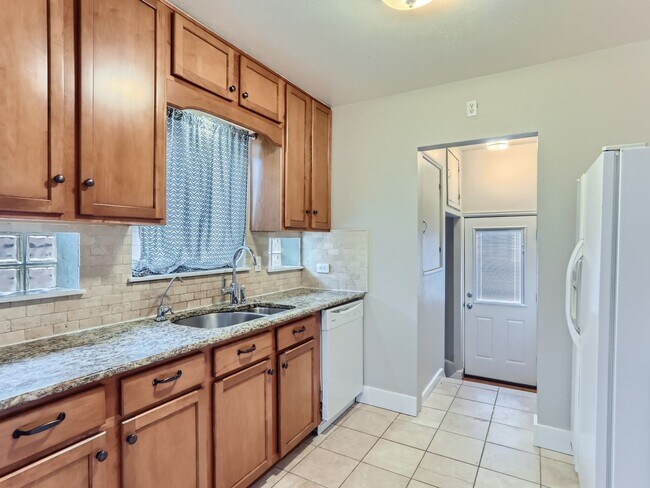 Building Photo - Evolve Real Estate: Available 8/8/26 Brick Tudor with Large Yard and Finished Basement!