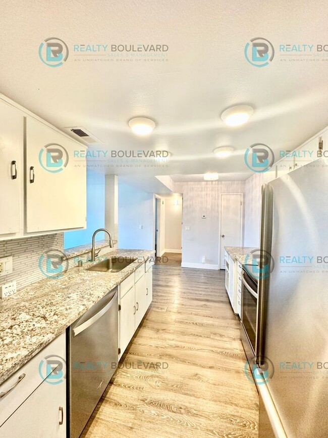 Building Photo - Indulge in comfortable living at Wood Chase Condos!