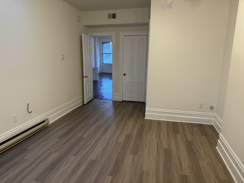 laminate flooring in bedroom area - 118 Philip St