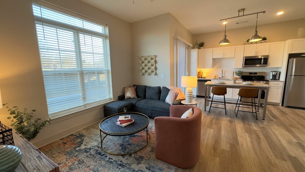 Experience the warmth and elegance of this beautifully designed open-concept living area. - Triton Scotts Addition - Monument