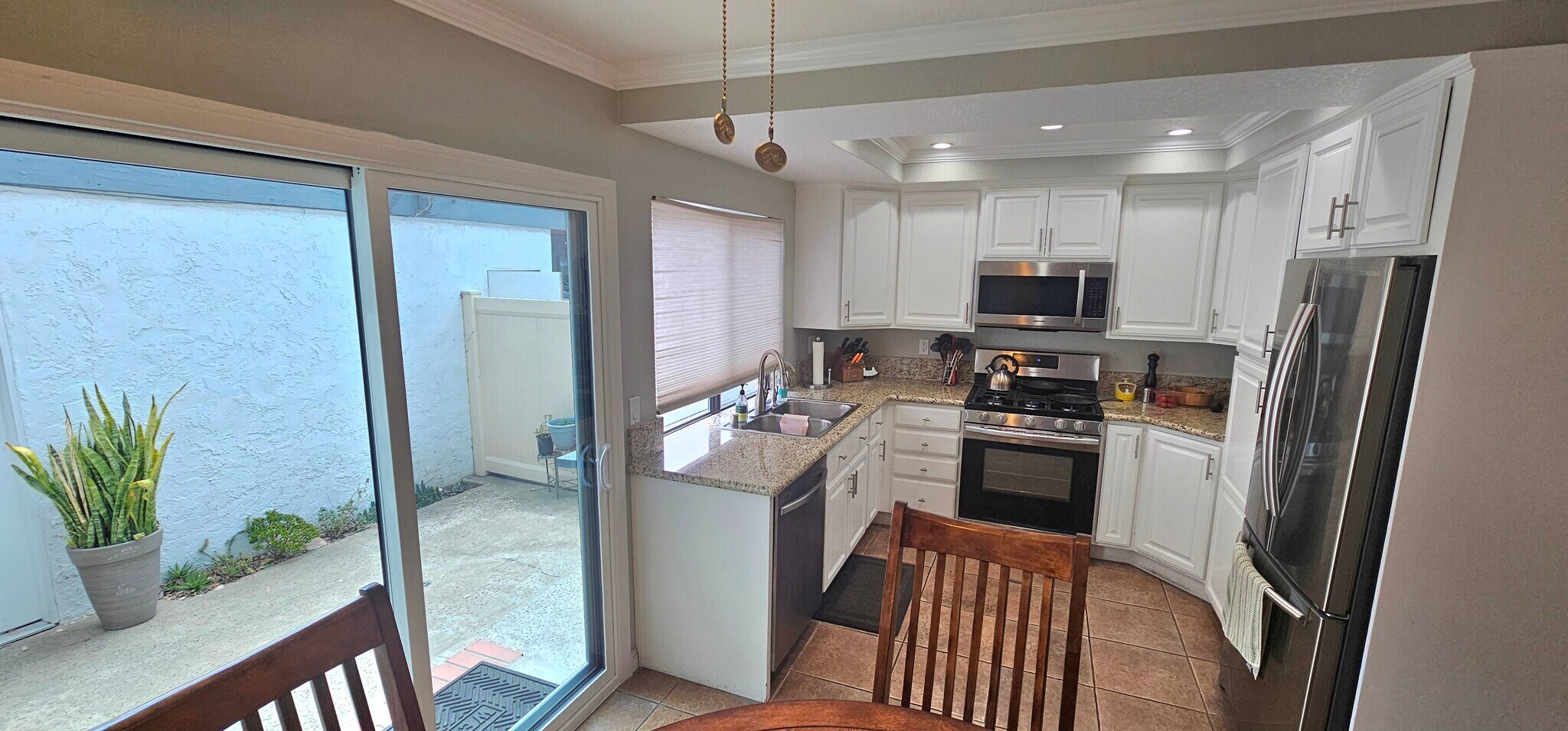 Kitchen with View of Back Patio - 1910 W Palmyra Ave