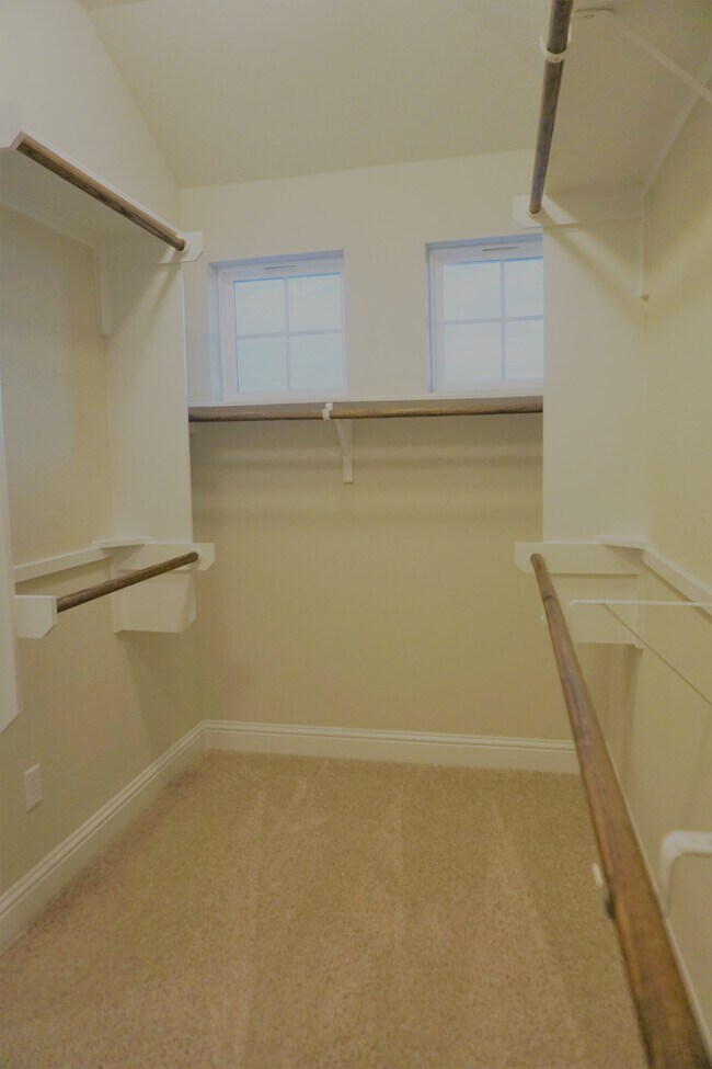 Nice sized walk in closet space w/ natural light in primary bedroom closet - 260 Gaida Loop