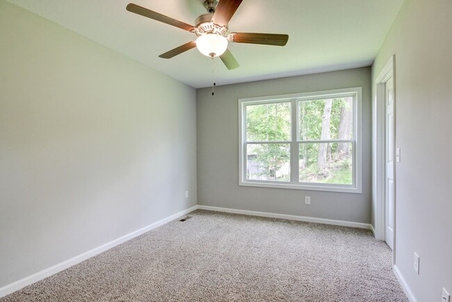 Building Photo - Two Story Duplex With Hardwood Flooring and White Cabinetry