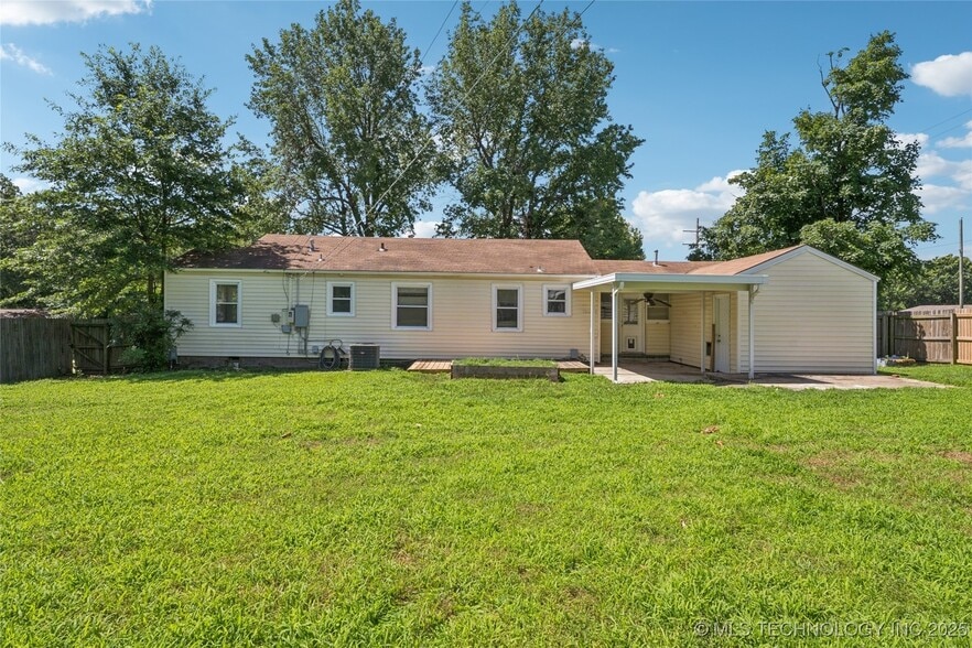 back of home and covered patio - 4903 E 25th St