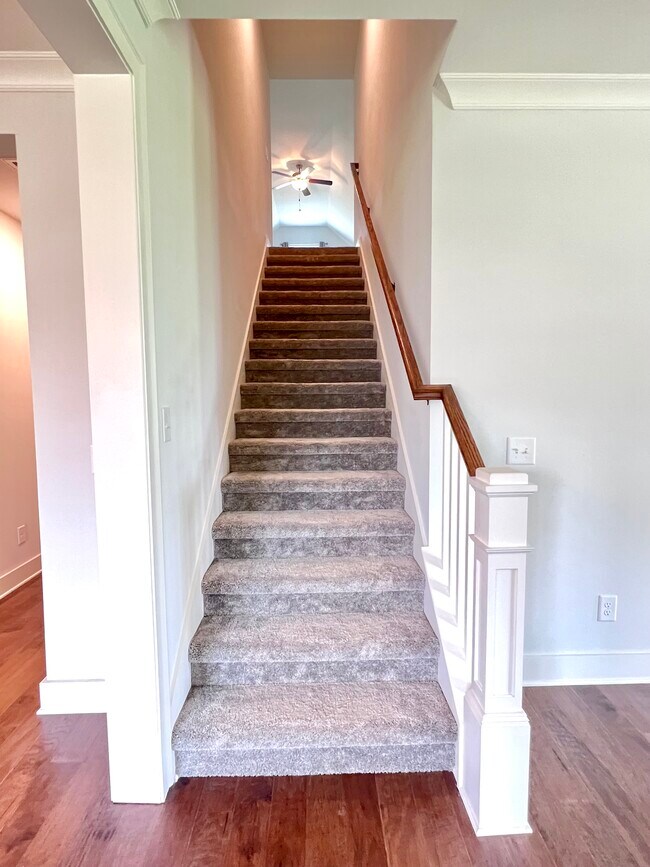 Staircase leading to the bonus room. - 47 Bowman Ct